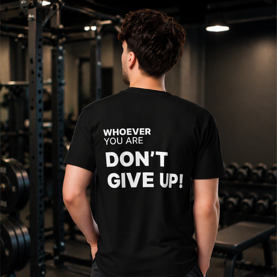 Person wearing the Don’t Give Up! motivational t-shirt in black with a bold back print