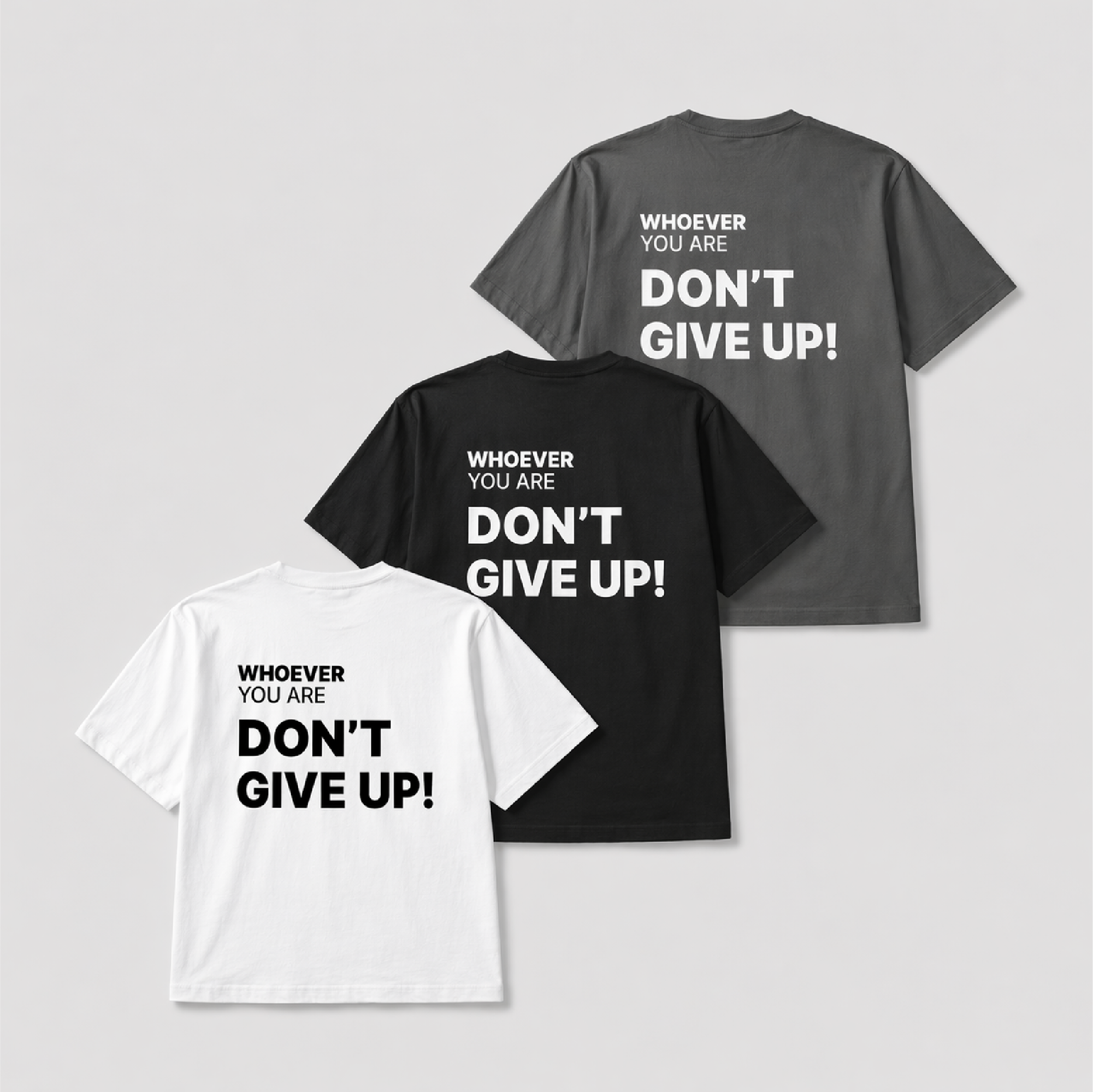 Don’t Give Up! t-shirt shown in white, black, and gray colour options