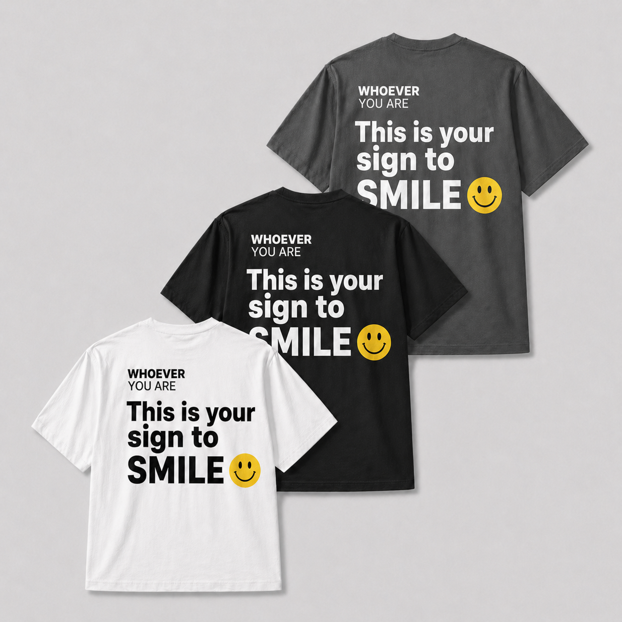 This Is Your Sign to Smile t-shirt shown in white, black, and gray colour options