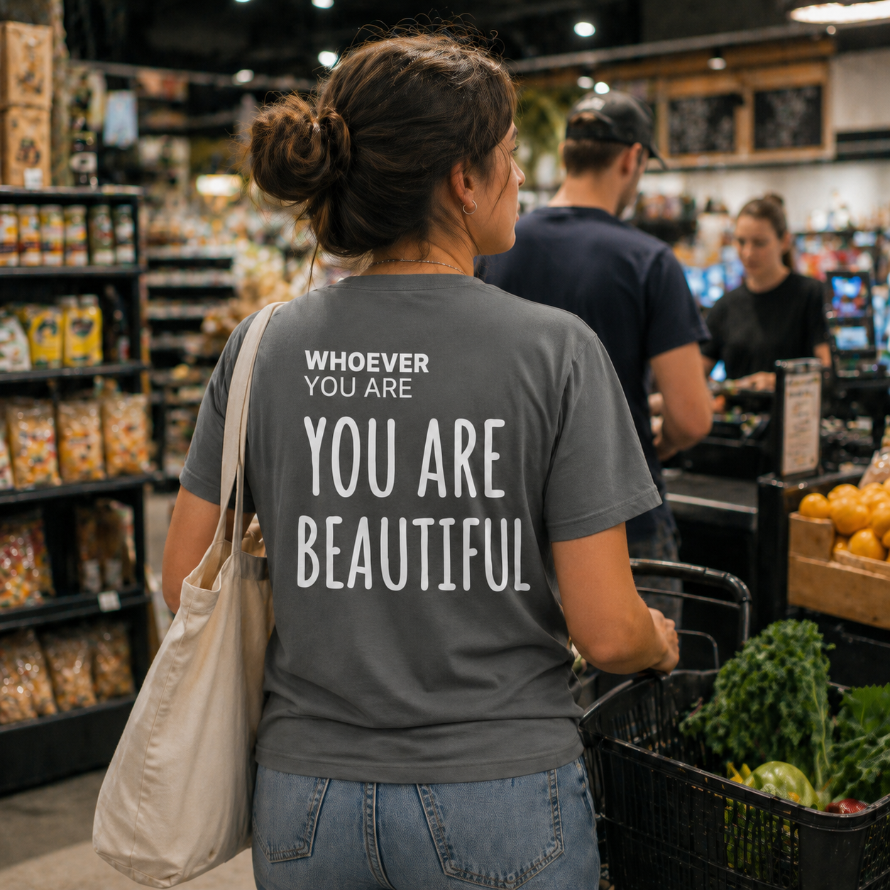 Person wearing a gray You Are Beautiful t-shirt in a store with back print visible