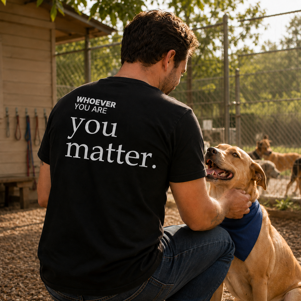 Person wearing a black You Matter t-shirt outdoors with back print visible